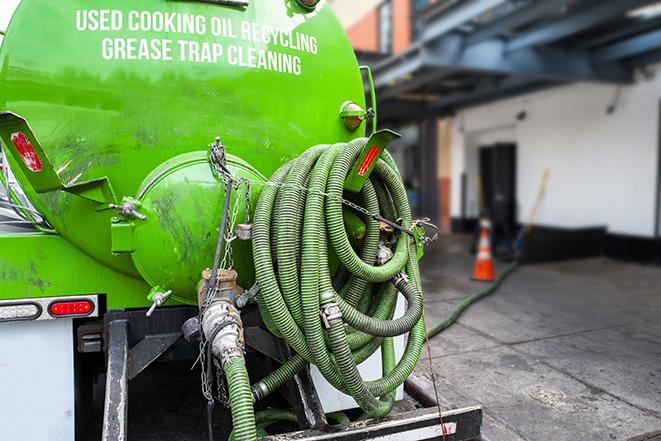 a service truck pumping grease from a restaurant's grease trap in Brandon MS